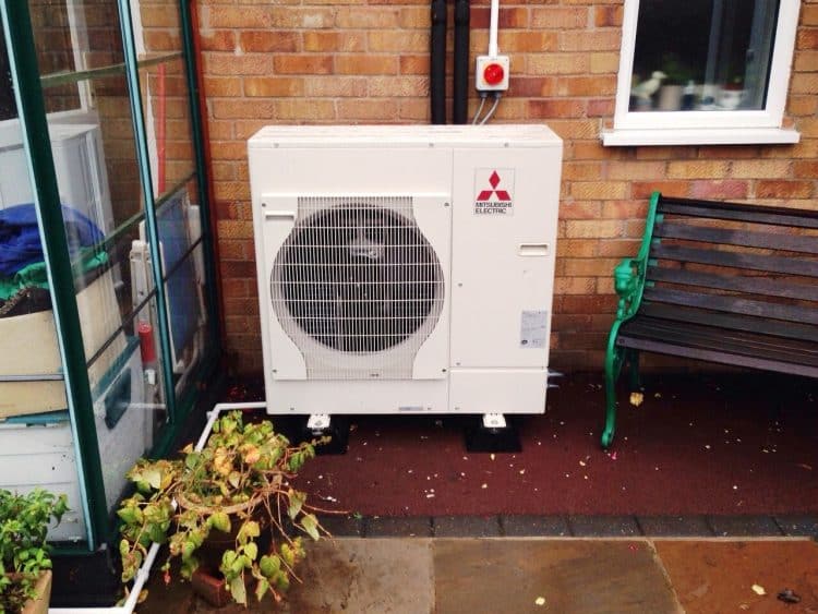 image of air source heat pump fitted in garden