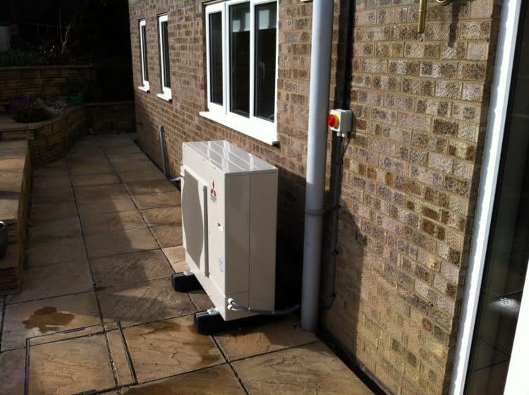 image of air source heat pumps fitted around rear of house