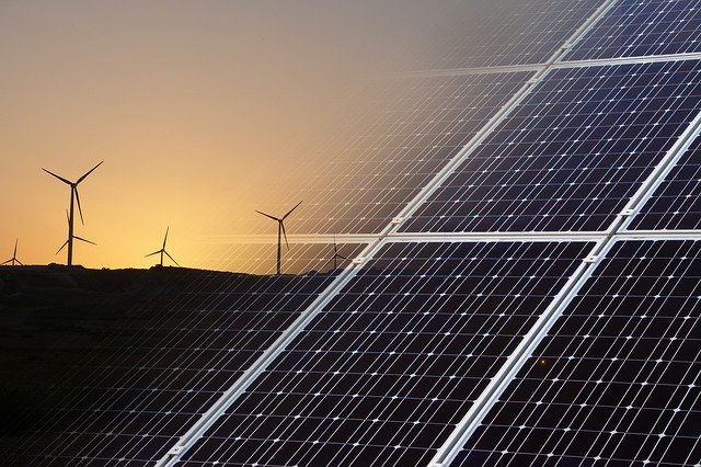 image of windmills & solar panels representing renewable technologies for heating