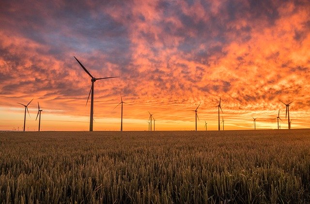 image of windmills against the backdrop of the sky representing energy generation